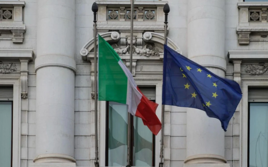 Bandeiras da Itália e da União Europeia hasteadas, representando o AIRE italiano.
